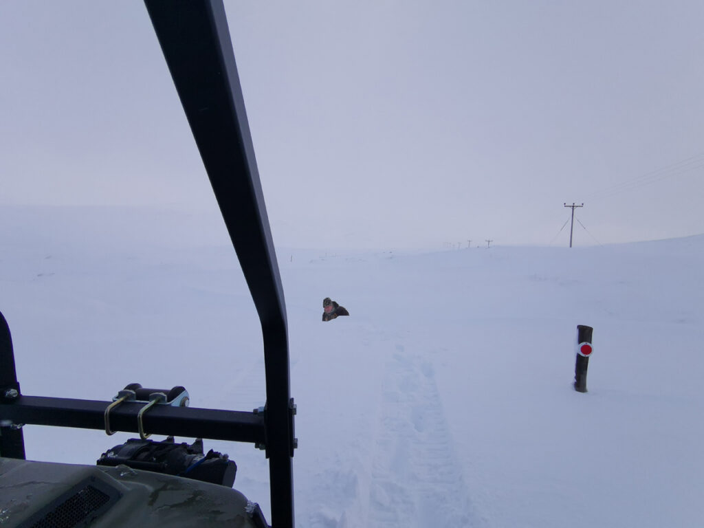  A short winter's tale about remote living photograph is a snowy scene observed from an Argocat with a channel being dug out of a snowdrift